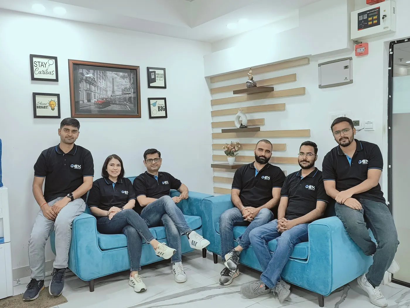 The OEX Tech team in the office lounge